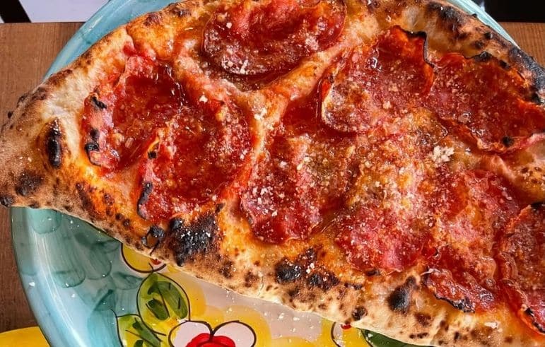 Caminetto-Pizzeria Pizzas que enamoran: Pizzerías imperdibles en Santo Domingo